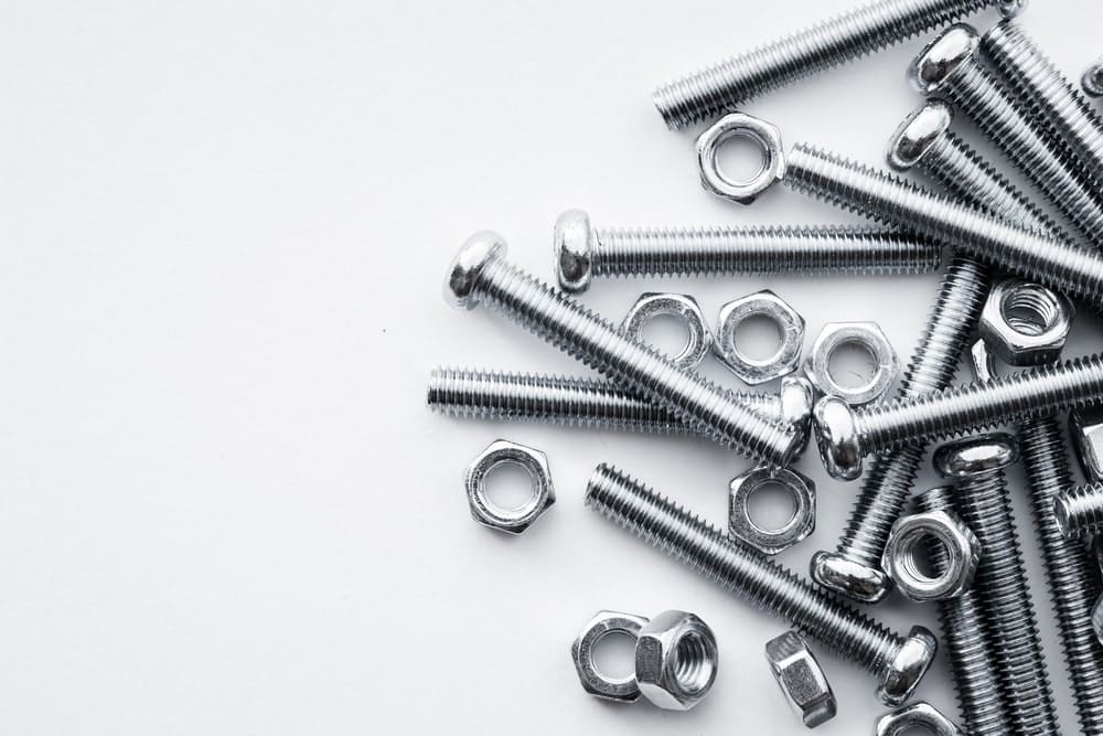 washers and screws on white background