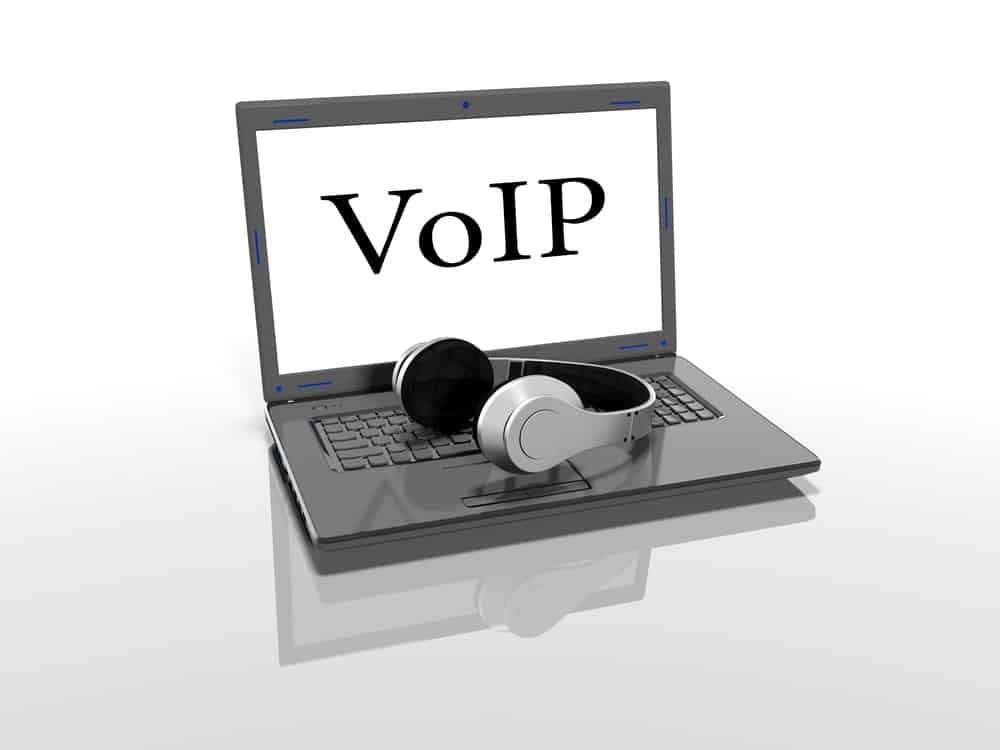 VoIP on laptop with headphones