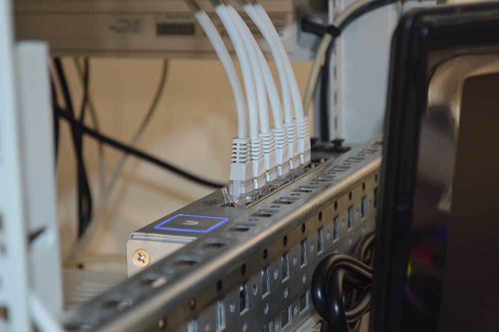 white ethernet cords plugged in